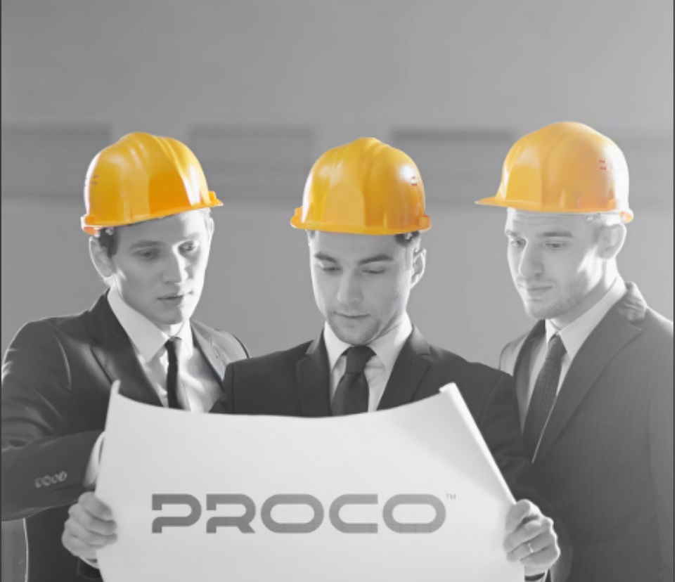Engineers reviewing blueprints with Proco logo